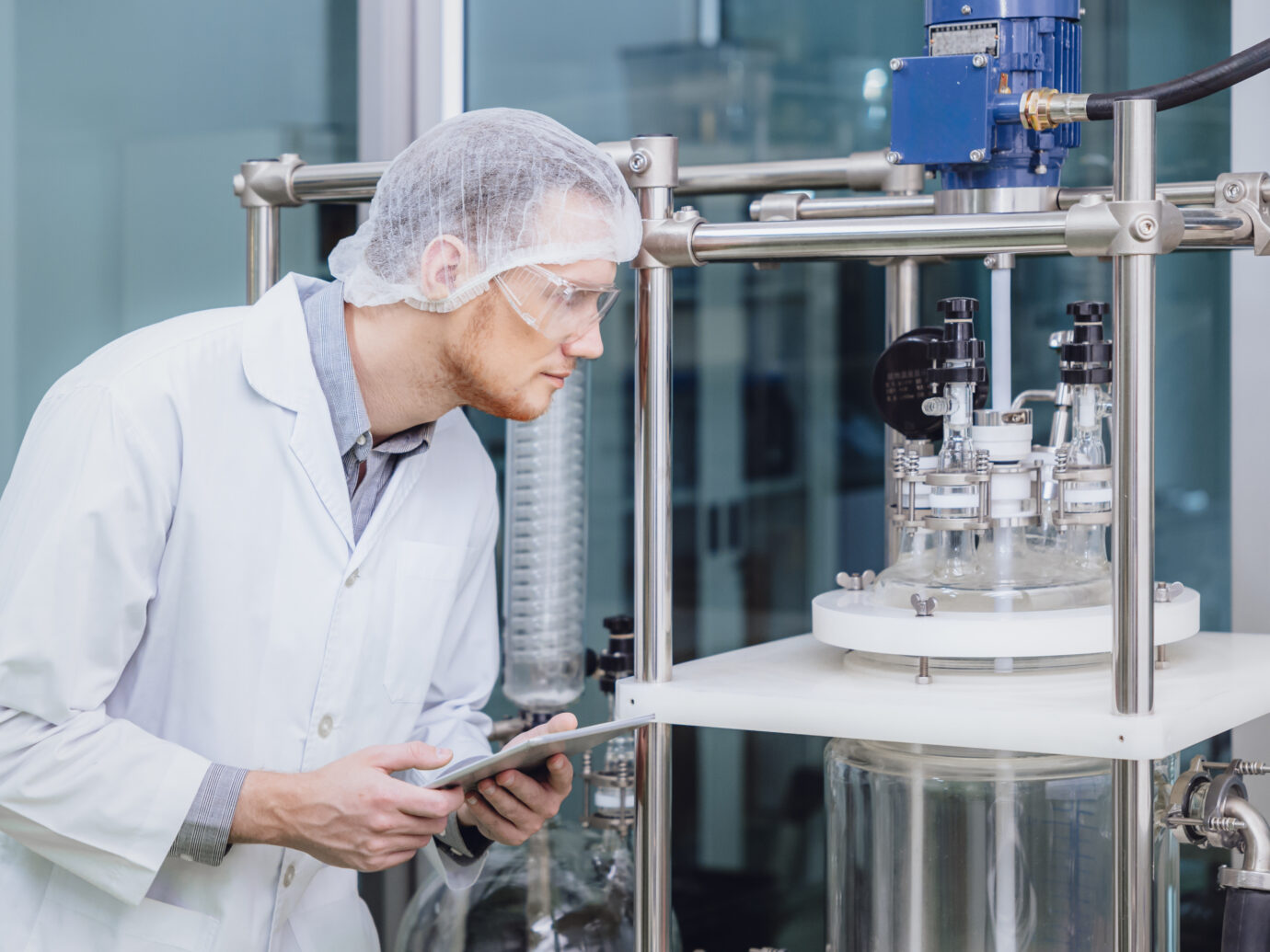 Man looking at manufacturing equipment