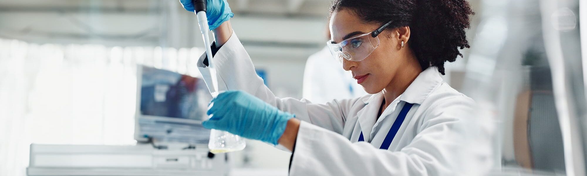 Woman filling a test tube